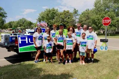 Group of parade participants with campaign signs